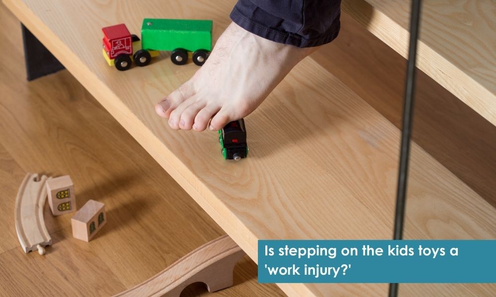 Man working from home about to step on kids toys on stairs