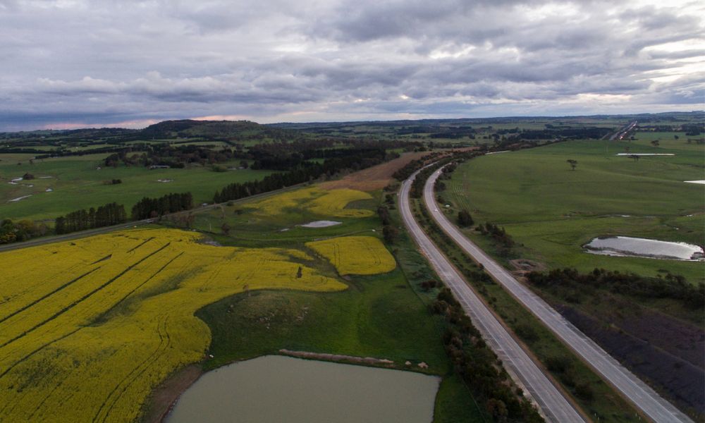 Photo of Hume Highway in Australia gently curving through fields