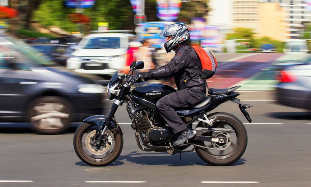 Australian motorcycle with cars on road